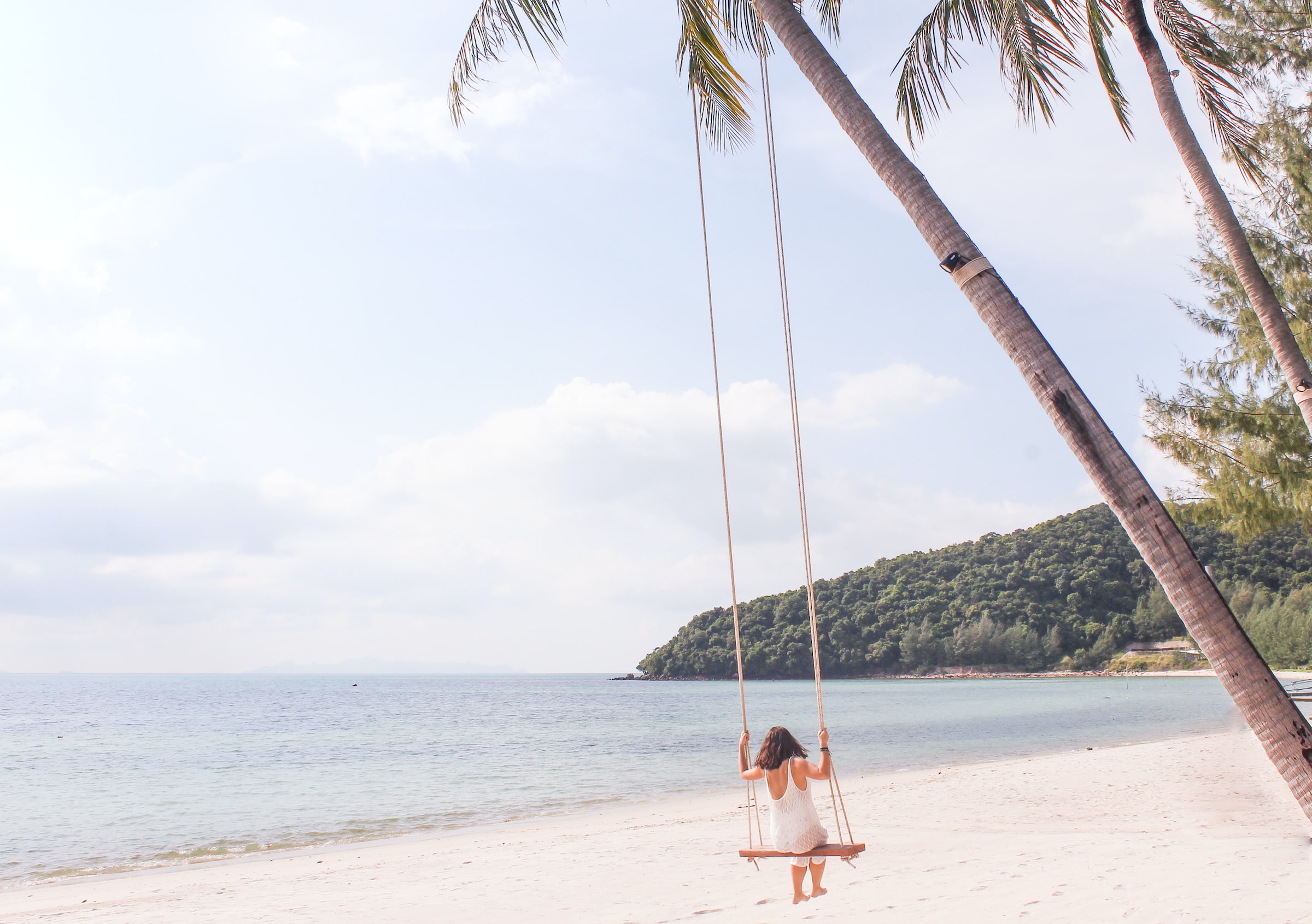 Woman on a swing on Chaweng beach on Koh Samui