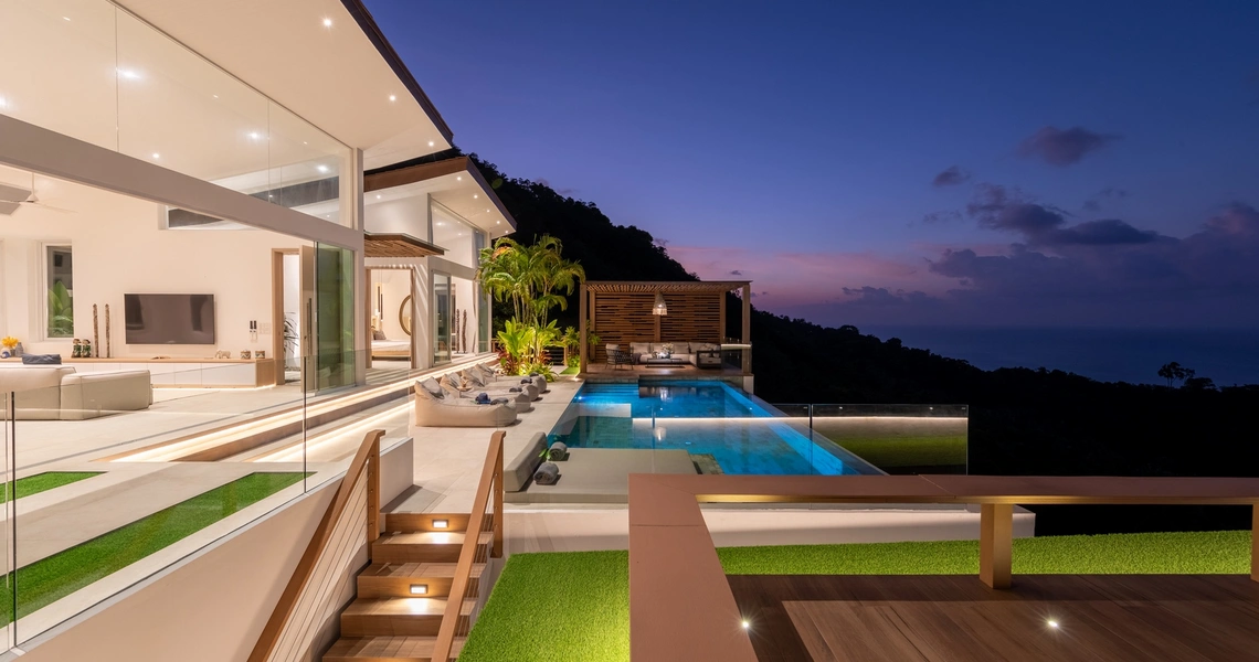 Pacific Palisade Samui luxury villa - deck and swimming pool at night