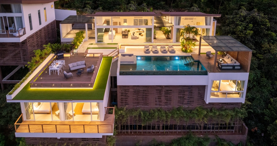 Pacific Palisade Samui luxury villa - frontal drone view at night