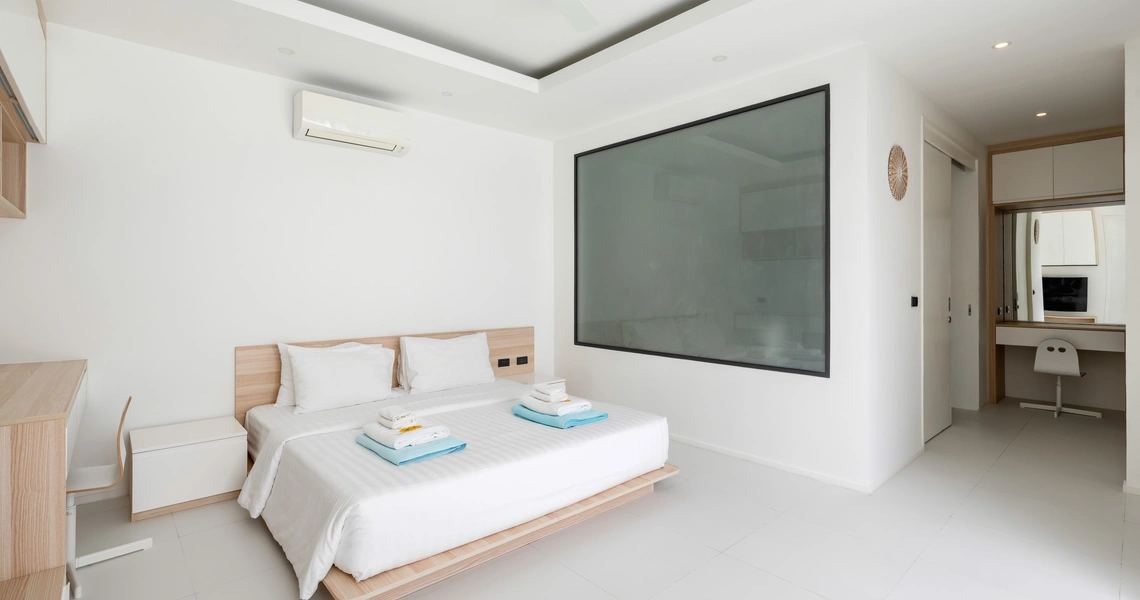 Hideway Villa Samui - bedroom with en-suite bathroom behind frosted glass